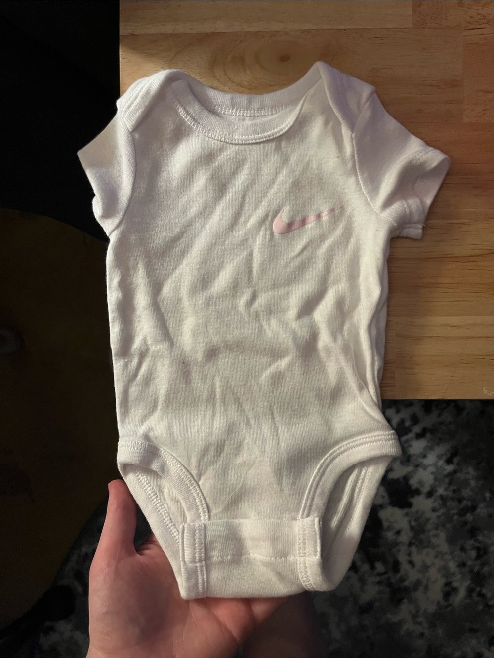 Nike White Baby One-Piece Bodysuit with Pink Swoosh